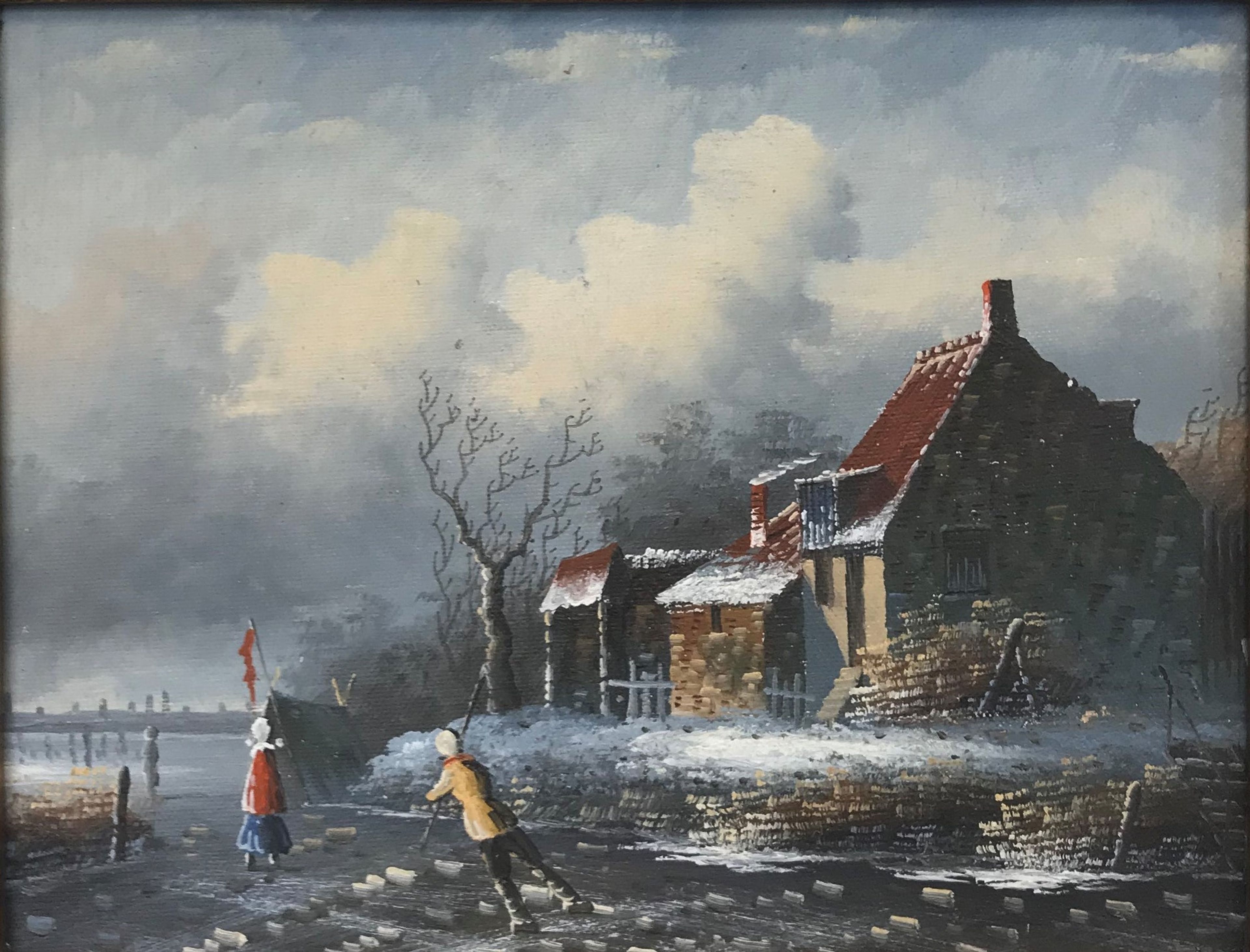 Patineurs sur glace près d'un chalet