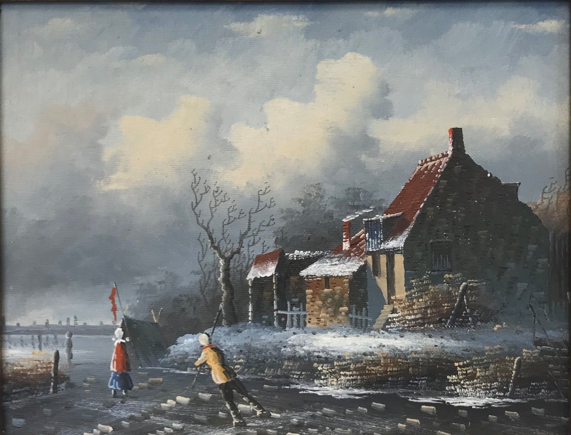 Patineurs sur glace près d'un chalet