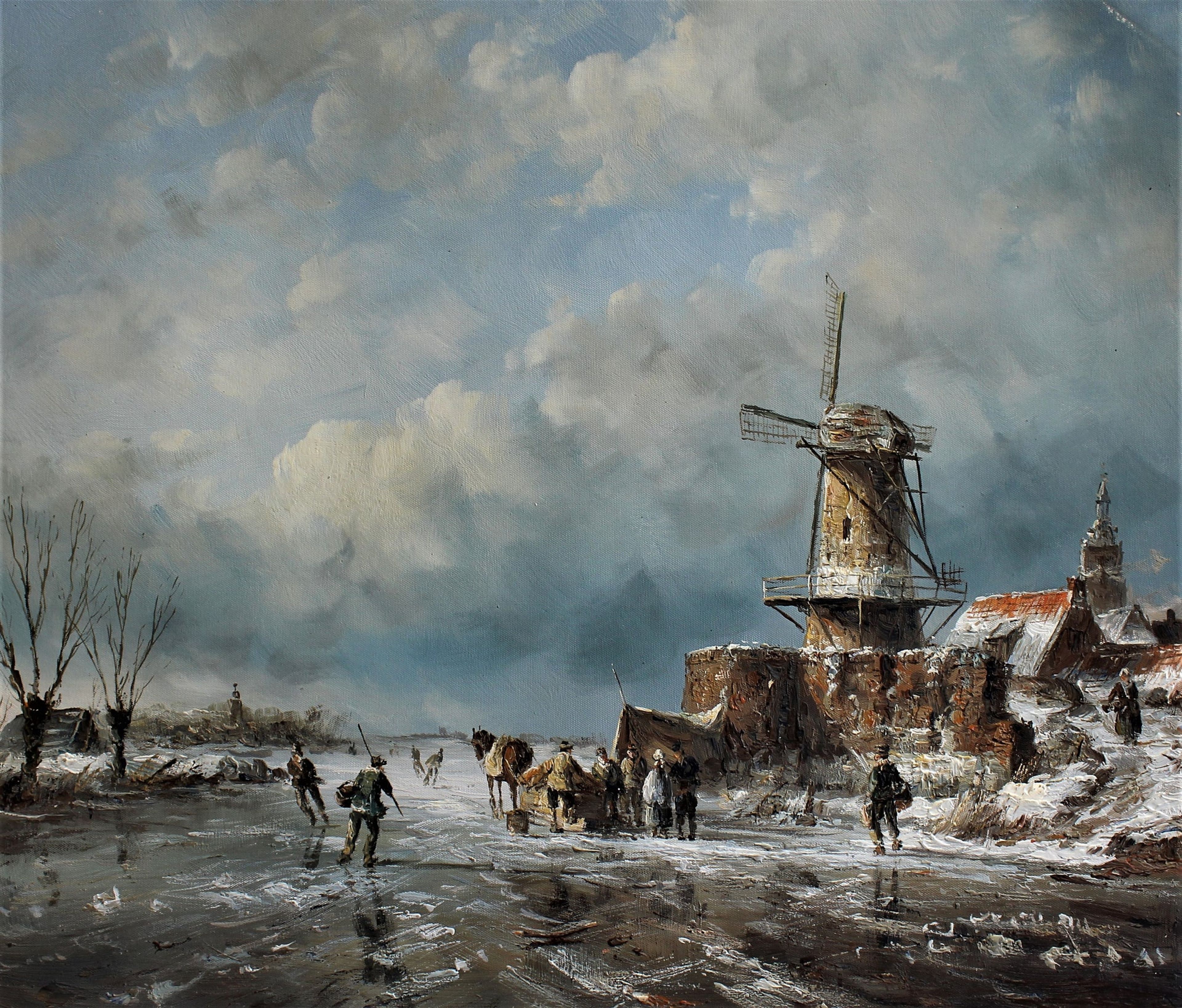 Patinage artistique sur une rivière glacée à côté d'un moulin à vent