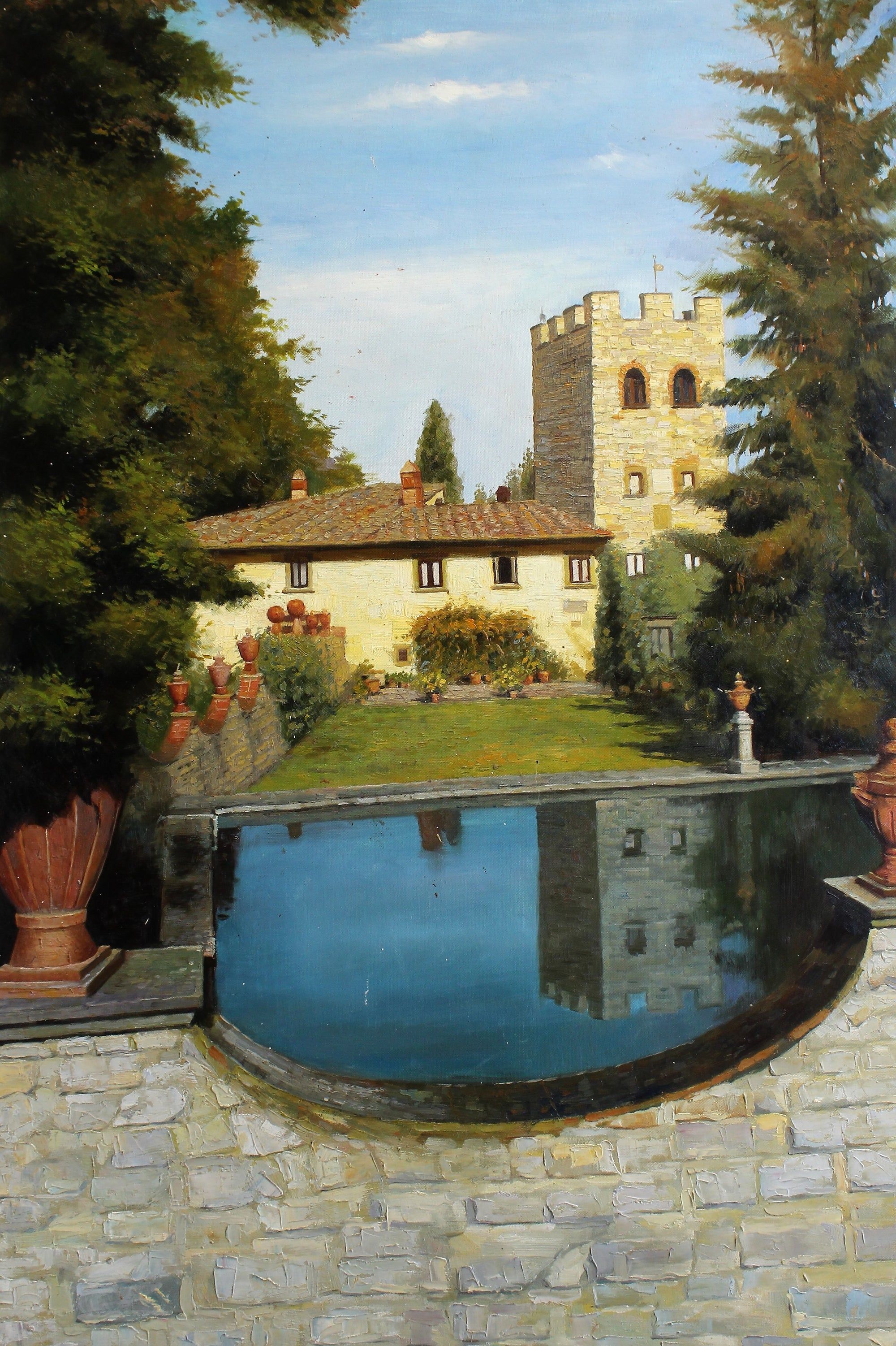 Bâtiment avec une tour et un petit étang
