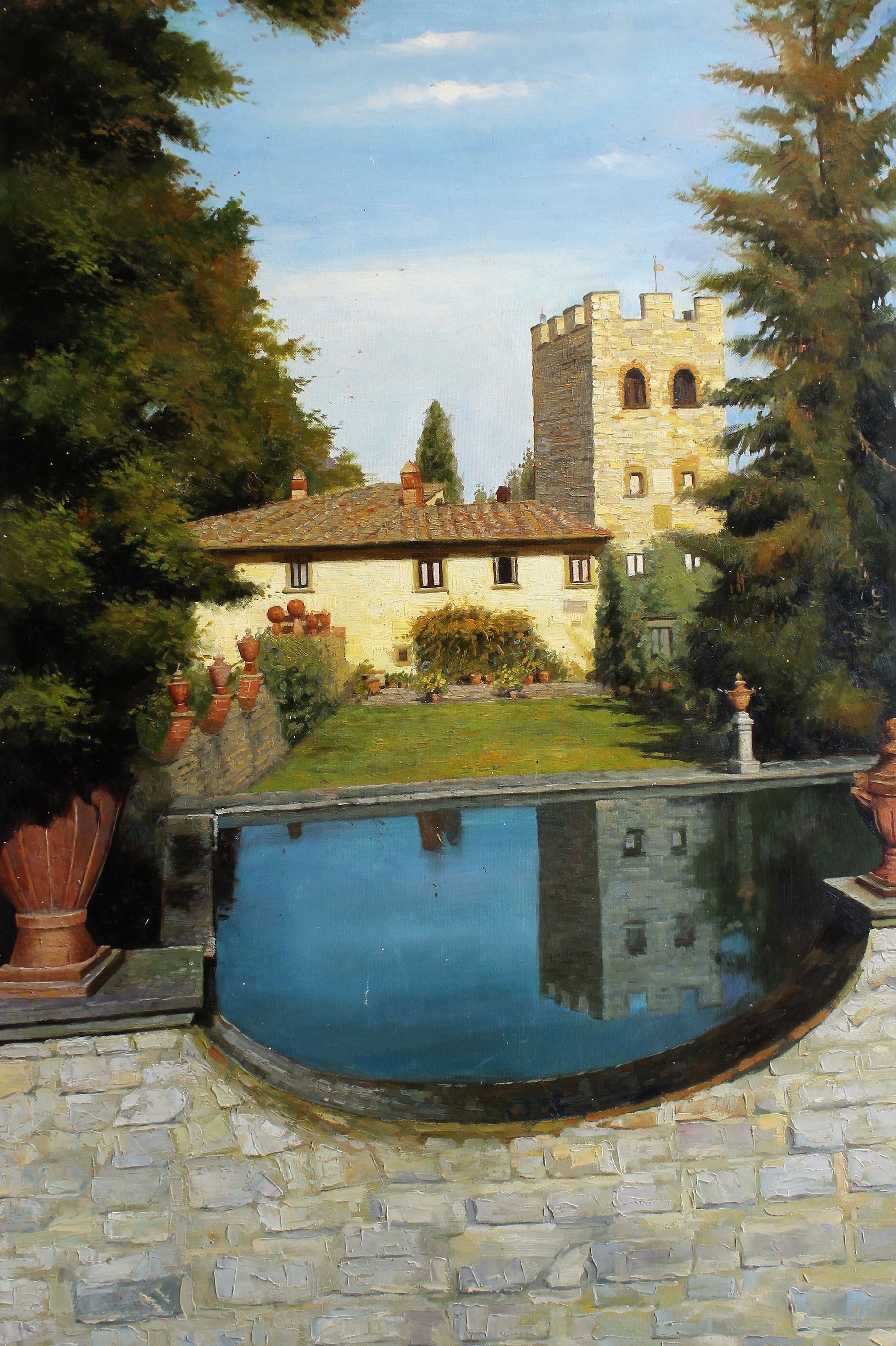 Bâtiment avec une tour et un petit étang