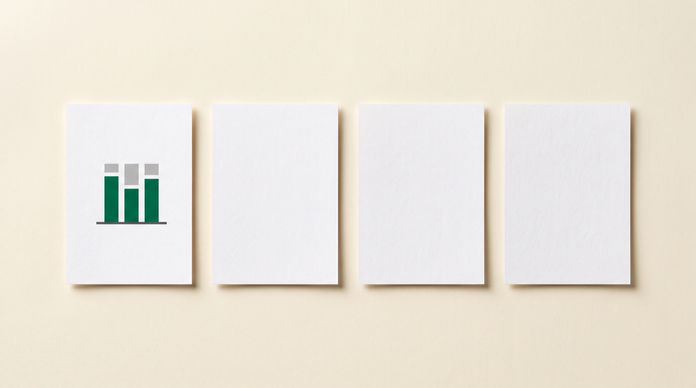 Four sheets of paper in a row, only the first one printed with a small chart, the other three blank