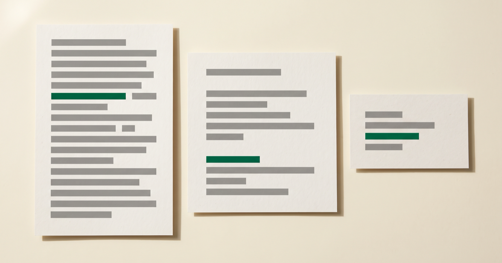 Three printed documents of different formats side by side, each with one line highlighted in the same green, at a different place on each