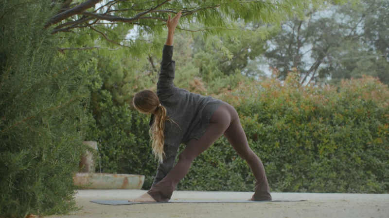A guest stretching in the desert light at Cuyama Buckhorn