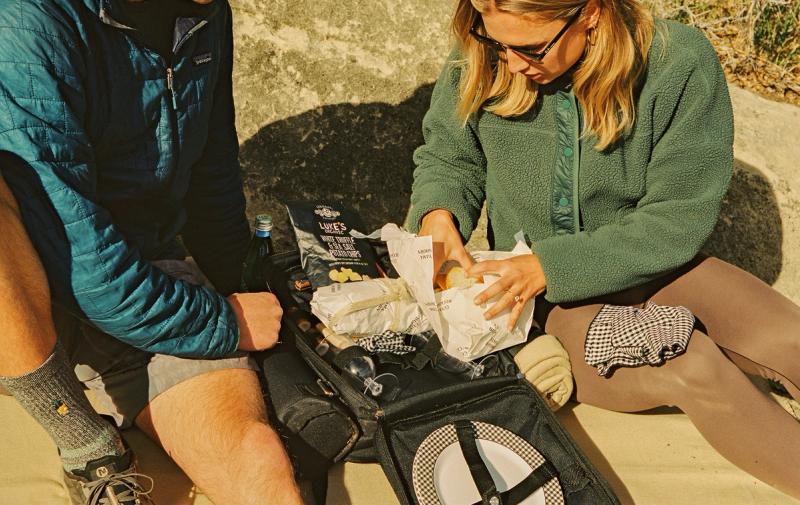Setting up for a mid-hike meal with a picnic basket