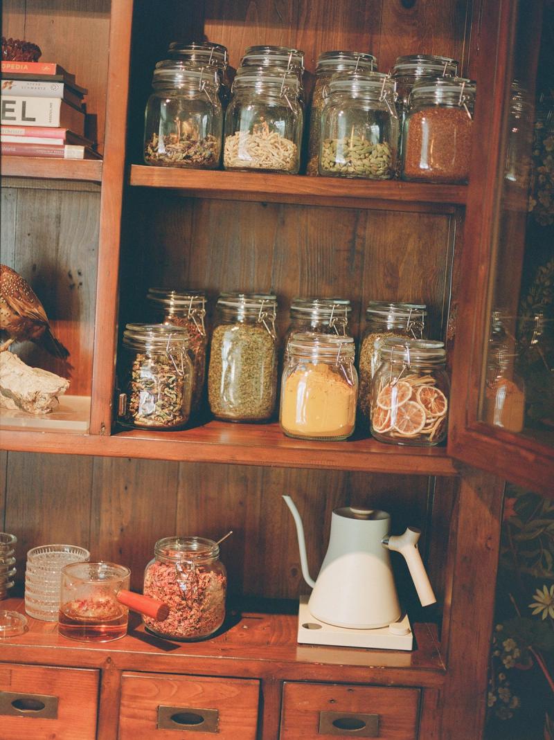 Apothecary cabinet stocked with loose leaf teas for Cuyama Buckhorn's Tea Room honor bar.