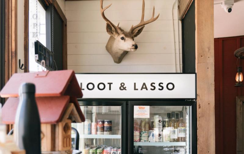 Buck heads and the Loot & Lasso cooler inside the market