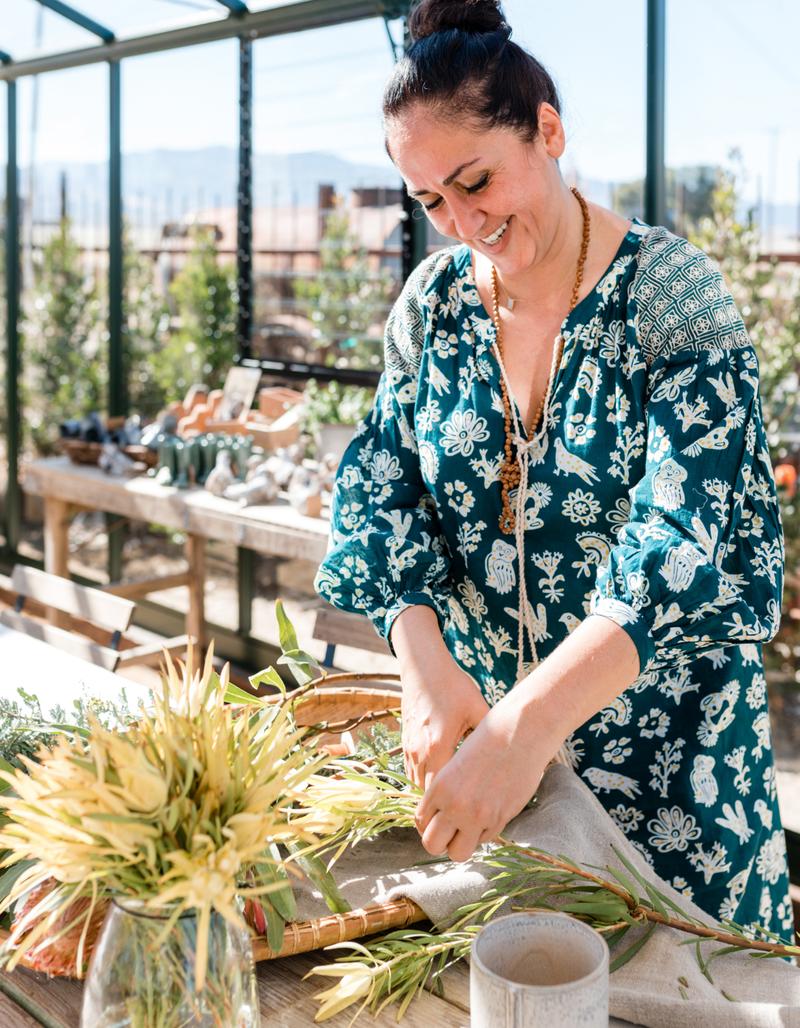 Ferial preparing fresh herbs for drying and steeping
