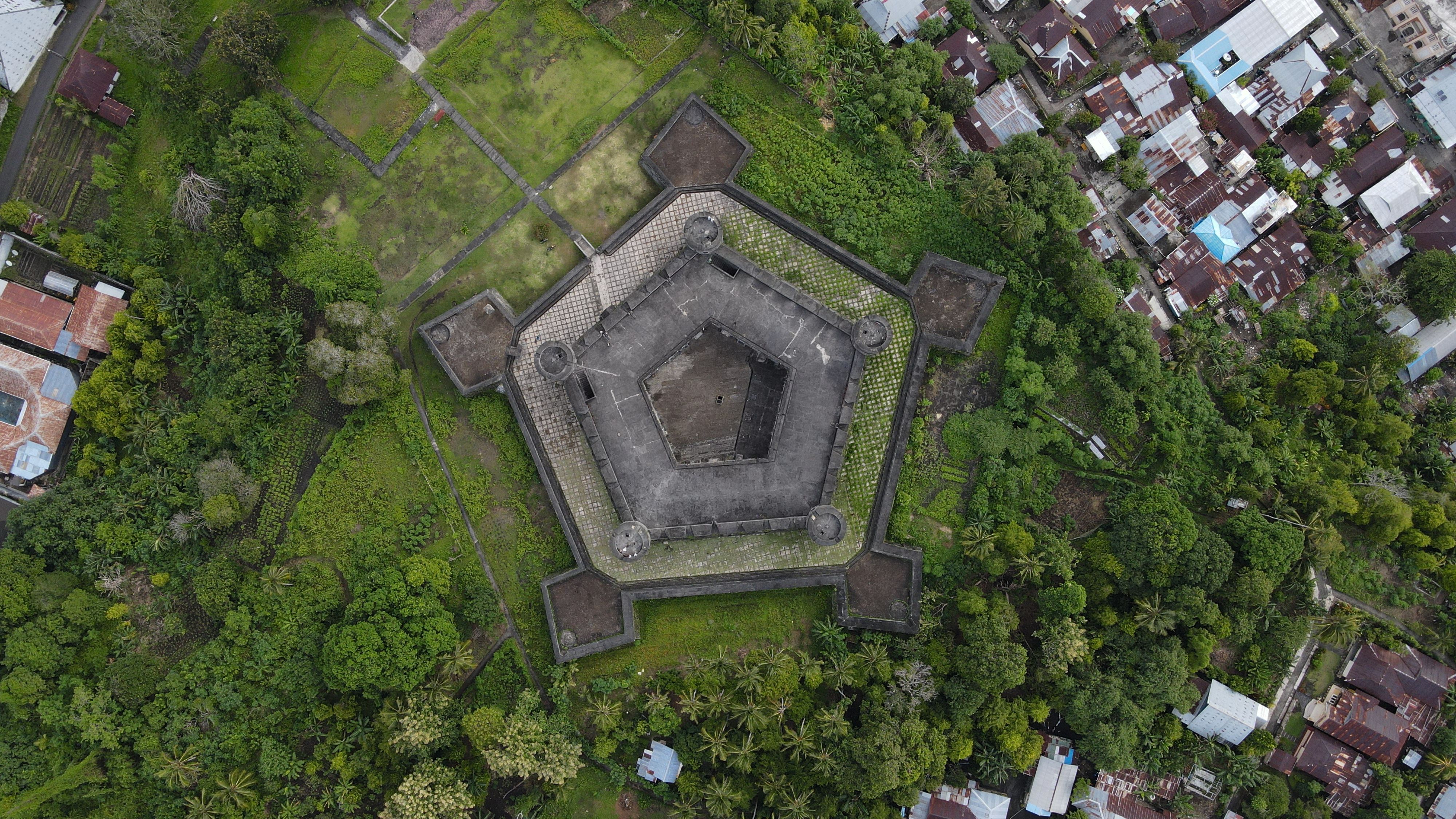 The pentagonal walls of Fort Belgica from above, with the town of Banda Neira and its nutmeg gardens around it