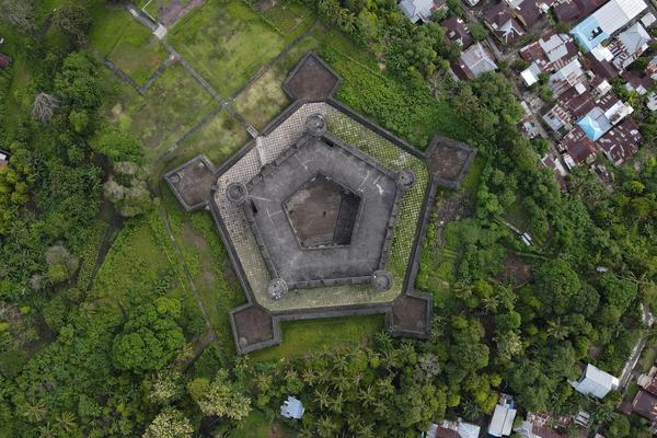 The pentagonal walls of Fort Belgica from above, with the town of Banda Neira and its nutmeg gardens around it
