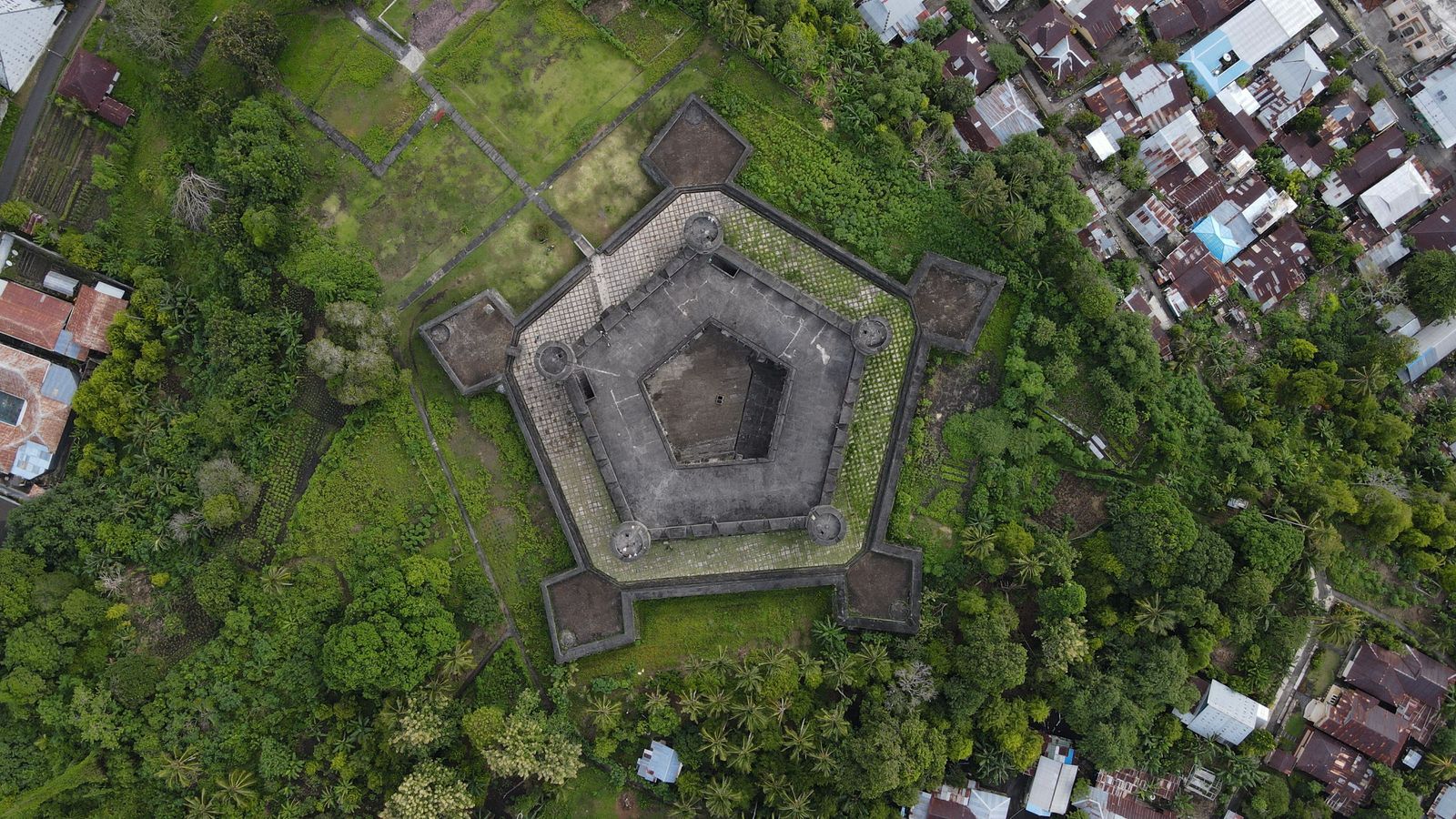 The pentagonal walls of Fort Belgica from above, with the town of Banda Neira and its nutmeg gardens around it
