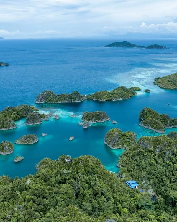 Raja Ampat karst islands and turquoise lagoons seen from above