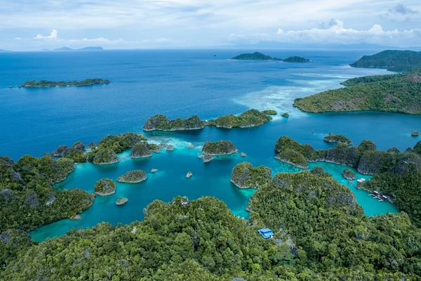 Raja Ampat karst islands and turquoise lagoons seen from above