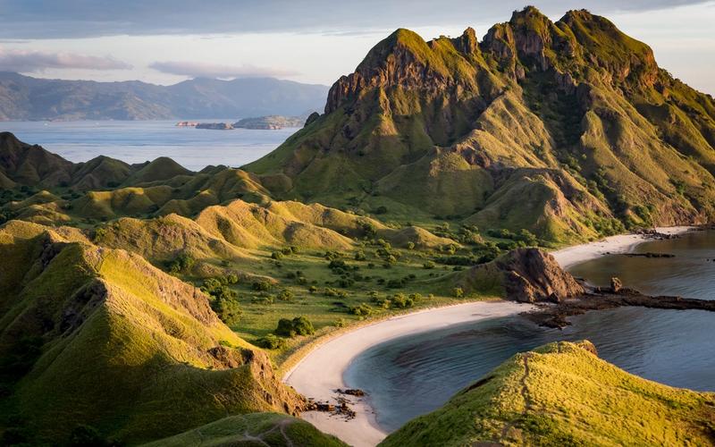 Padar Island at first light, with its curved bays and empty ridgeline in Komodo National Park
