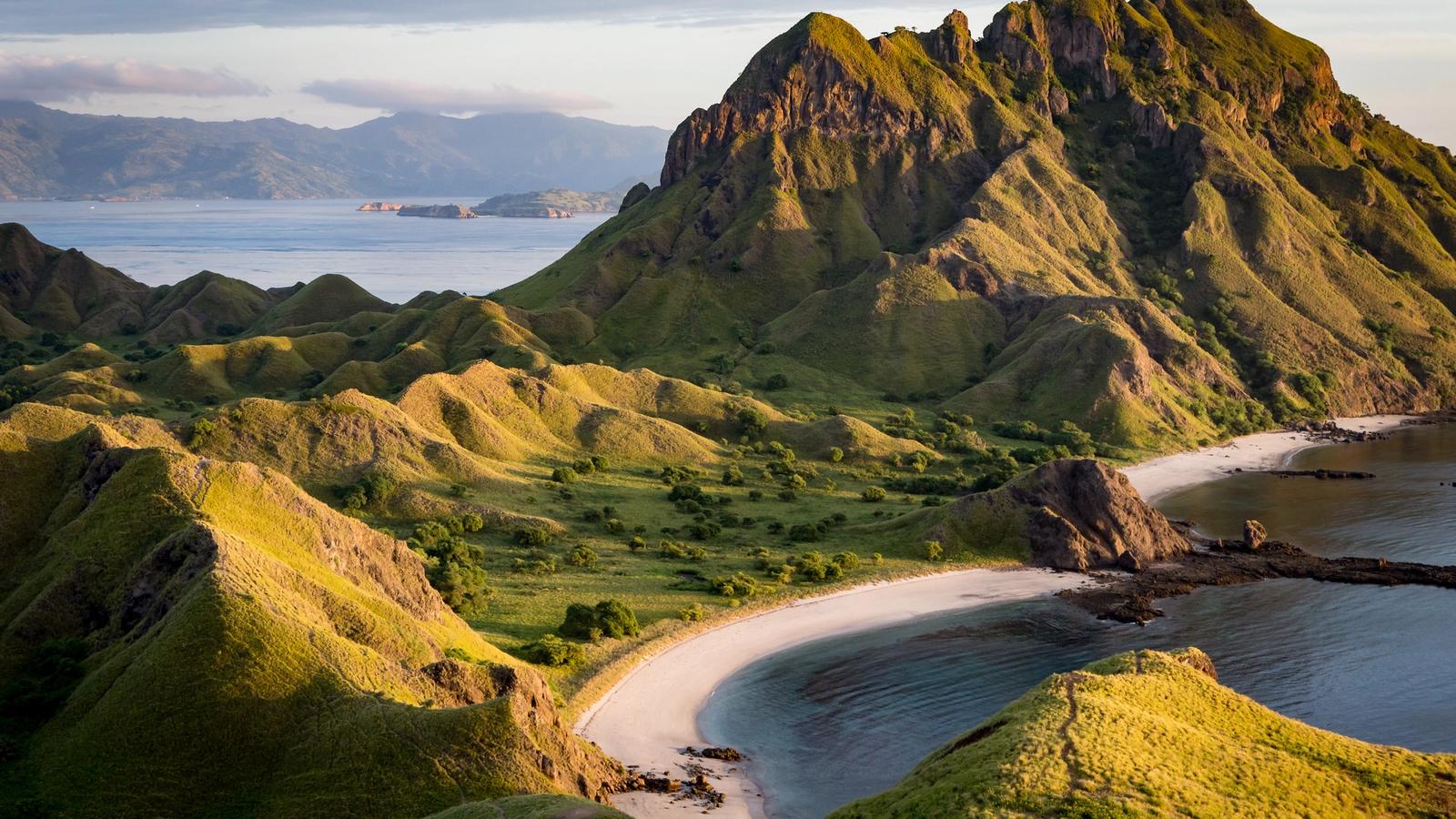 Padar Island at first light, with its curved bays and empty ridgeline in Komodo National Park