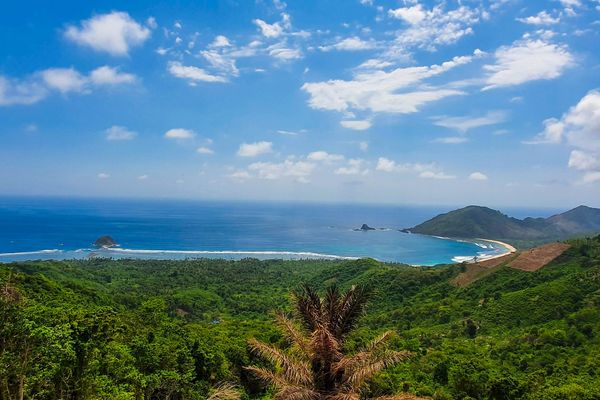 Mekaki Bay seen from the hills above Sekotong, southwest Lombok, with an empty beach and green headlands