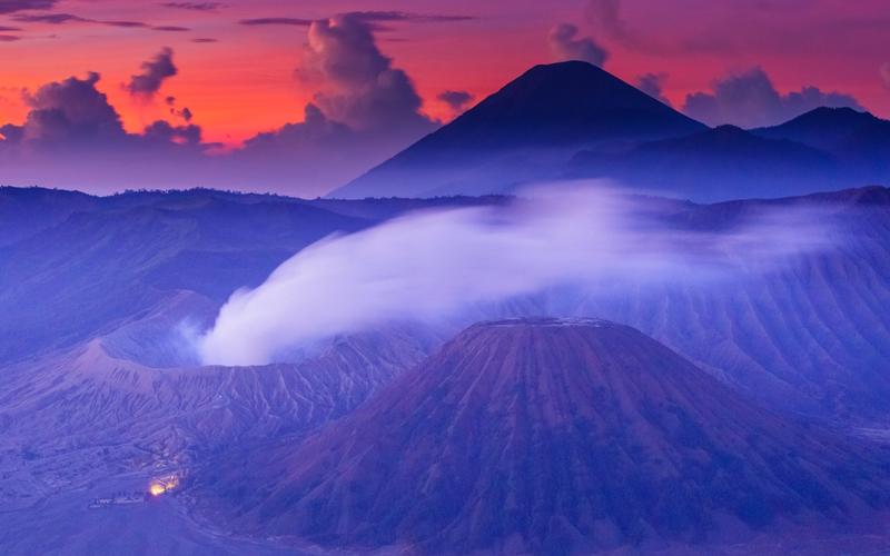 Mount Bromo at sunrise, its crater smoking inside the Tengger caldera, East Java