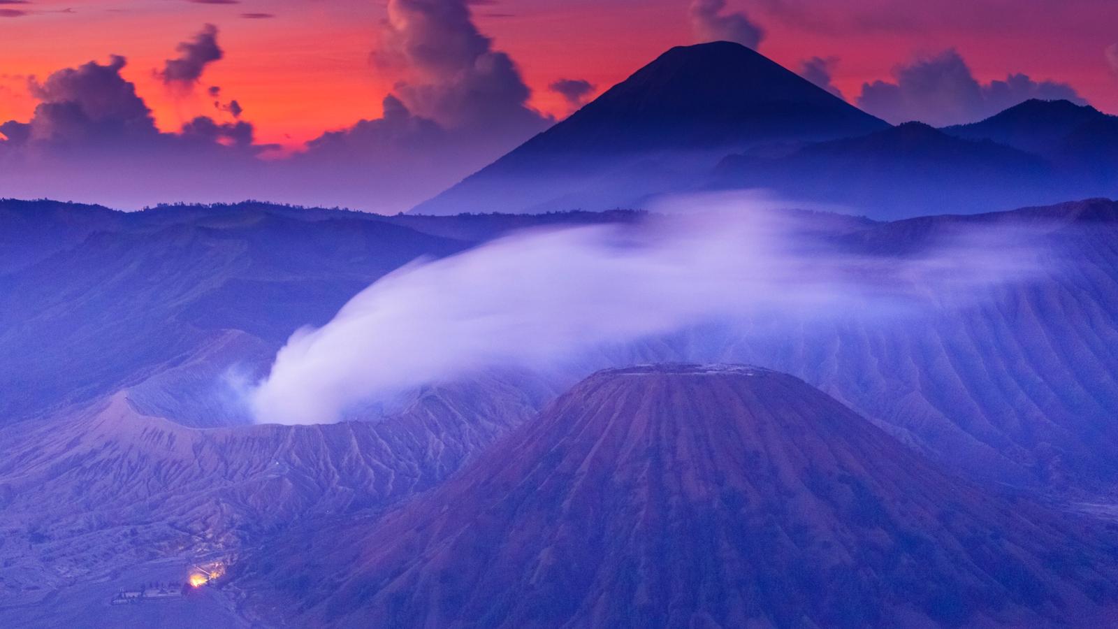Mount Bromo at sunrise, its crater smoking inside the Tengger caldera, East Java
