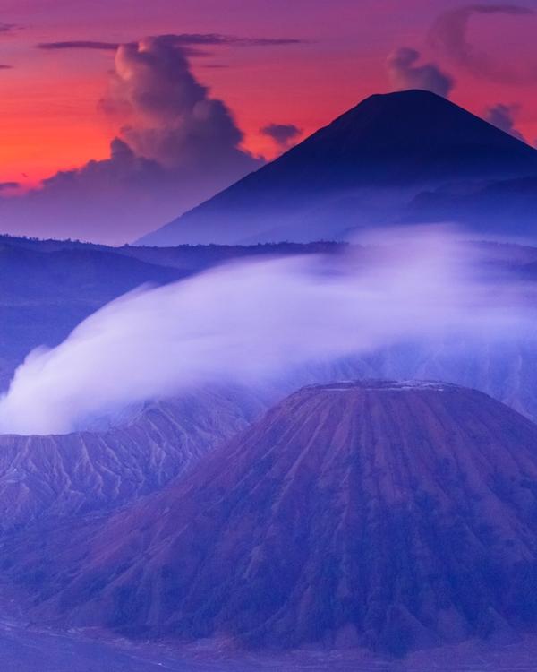 Mount Bromo at sunrise, its crater smoking inside the Tengger caldera, East Java