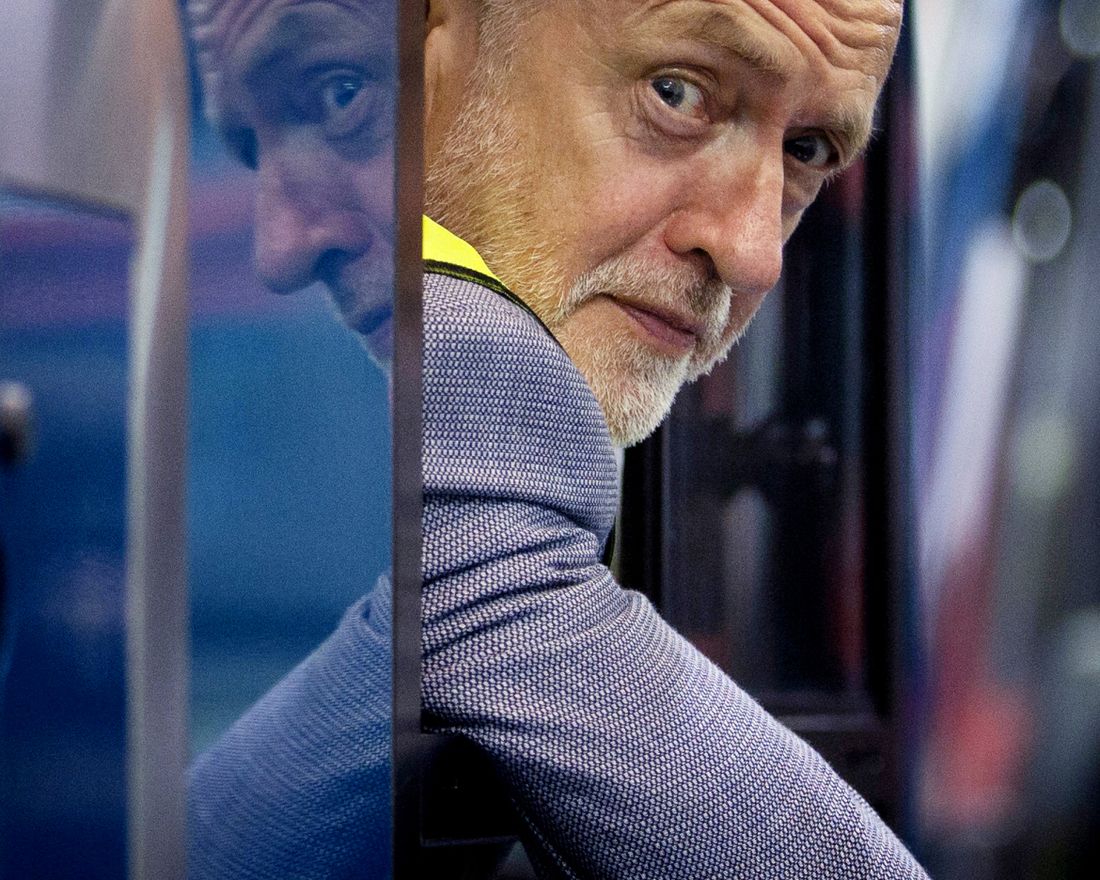 Britain's Labour leader Jeremy Corbyn looks out from the driving cab of a bus, during a visit to the Alexander Dennis bus manufacturer, in Falkirk, Scotland, to campaign on his party's 'Build It In Britain' policy, Monday Aug. 20, 2018. (Jane Barlow/PA via AP)