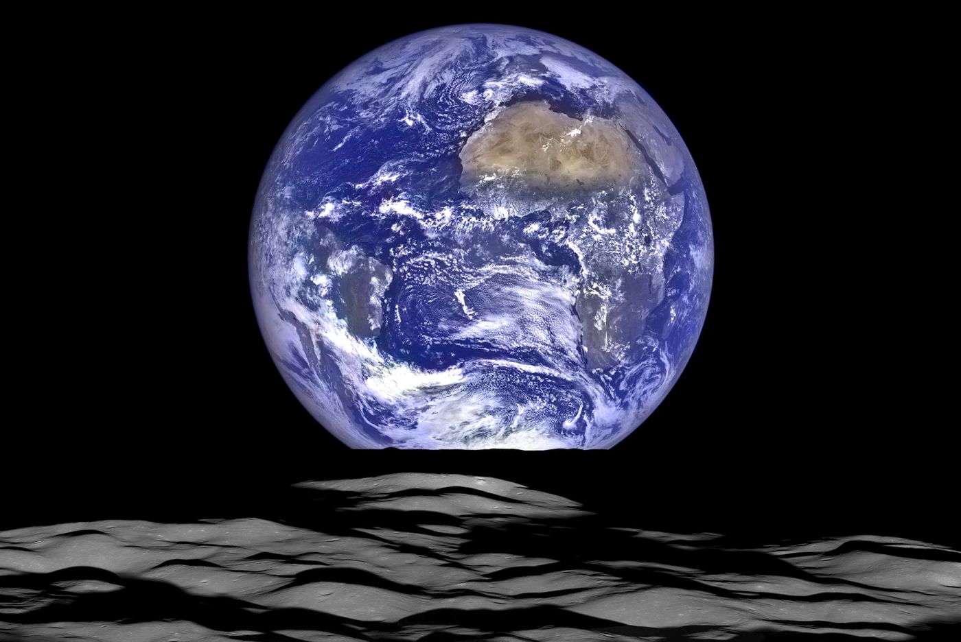 This NASA image released December 18, 2015 shows what  NASA's Lunar Reconnaissance Orbiter (LRO) recently captured in a view of Earth from the spacecraft's vantage point in orbit around the moon. In this composite image we see Earth appear to rise over the lunar horizon from the viewpoint of the spacecraft, with the center of the Earth just off the coast of Liberia (at 4.04 degrees North, 12.44 degrees West). The large tan area in the upper right is the Sahara Desert, and just beyond is Saudi Arabia. The Atlantic and Pacific coasts of South America are visible to the left. On the moon, we get a glimpse of the crater Compton, which is located just beyond the eastern limb of the moon, on the lunar farside. This image was composed from a series of images taken October 12, 2015 when LRO was about 83 miles (134 kilometers) above the moon's farside crater Compton. AFP PHOTO/NASA/HANDOUT = RESTRICTED TO EDITORIAL USE†- MANDATORY CREDIT "AFP PHOTO / NASA/HANDOUT" -†NO MARKETING NO ADVERTISING CAMPAIGNS - DISTRIBUTED AS A SERVICE TO CLIENTS = NO A LA CARTE SALES