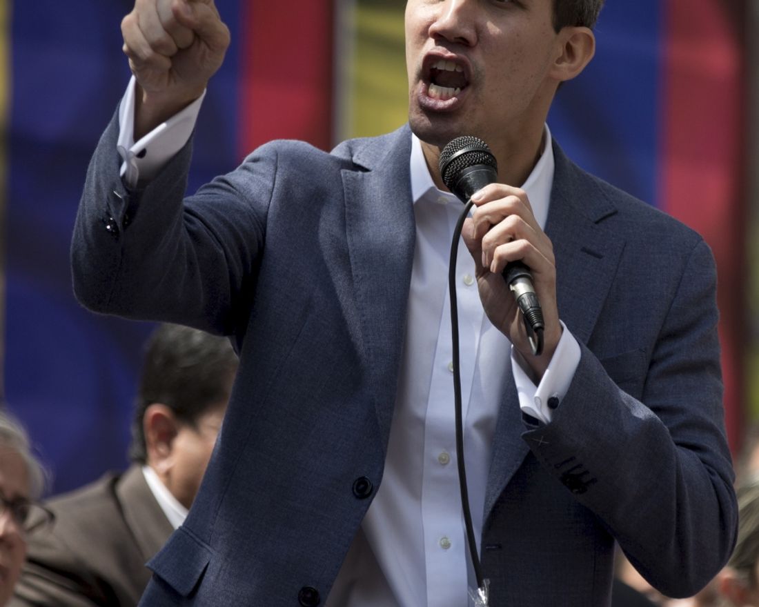 Juan Guaido, President of the Venezuelan National Assembly delivers a speech during a public session with opposition members, at a street in Caracas, Venezuela, Friday, Jan. 11, 2019. The head of Venezuela's opposition-run congress says that with the nation's backing he's ready to take on Nicolas Maduro's presidential powers and call new elections.(AP Photo/Fernando Llano)