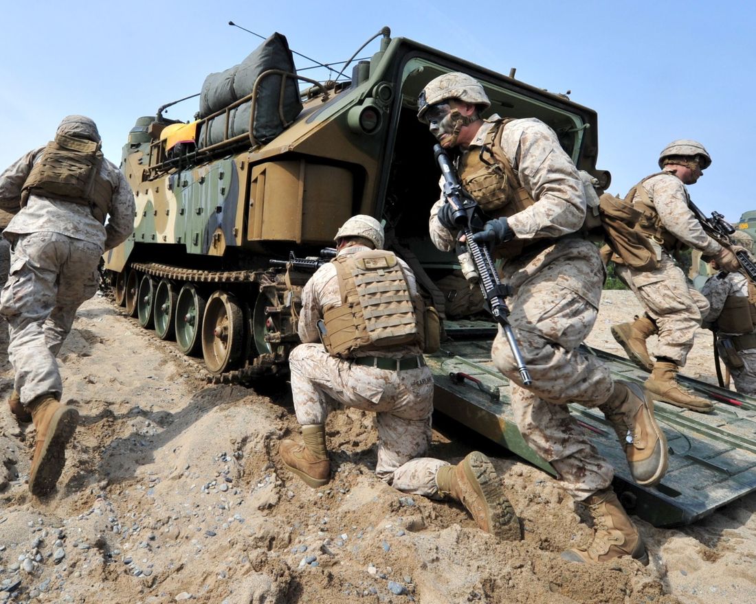 TOPSHOTS 
 US Marines get out from an amphibious assault vehicle during a joint landing operation by US and South Korean Marines in Pohang, 270 kms southeast of Seoul, on March 31, 2014. North Korea announced a live-fire drill on March 31 near its disputed maritime border with South Korea, further ratcheting up tensions a day after threatening a "new form" of nuclear test.  AFP PHOTO / JUNG YEON-JE