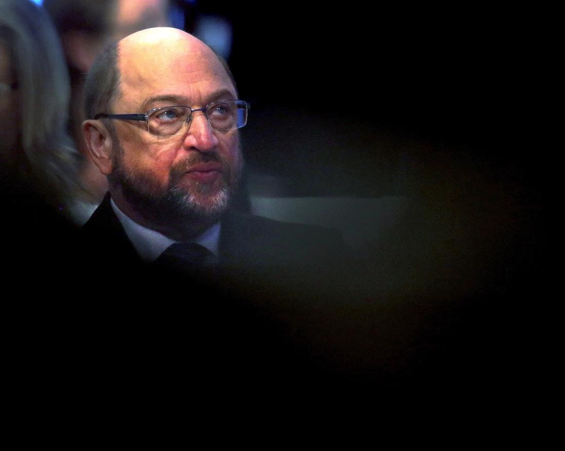 SPD leader Martin Schulz listens during a party meeting of the Social Democrats, SPD, who are discussing the possible coalition talks with Chancellor Angela Merkel's conservatives in Bonn, Germany, Sunday, Jan. 21, 2018. (AP Photo/Michael Probst)