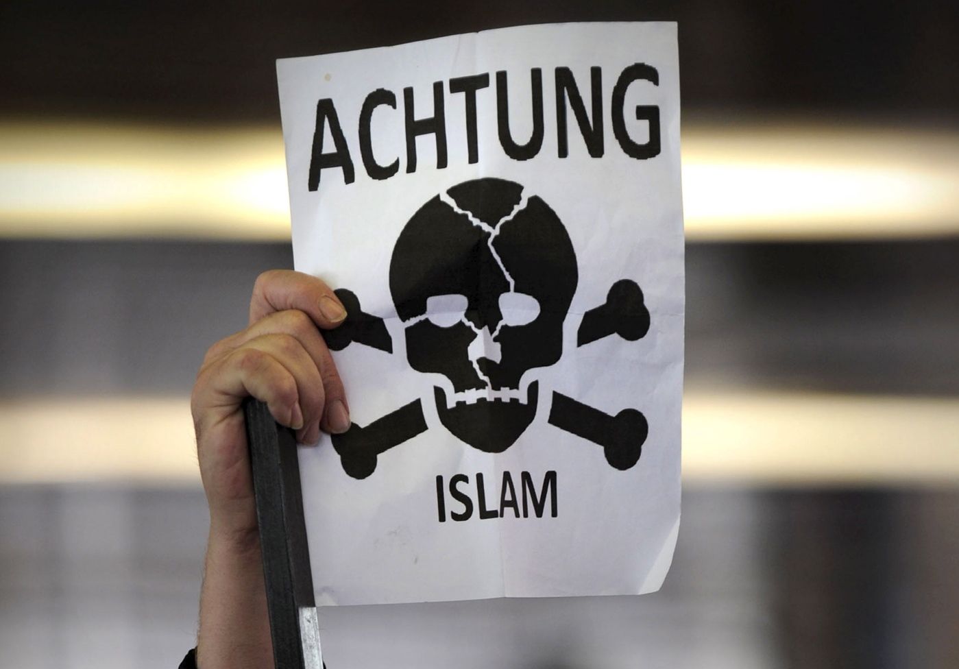 Members of the right-wing EDL (English Defence League)  group wait to enter Kings Cross underground station in central London after gathering at the station ahead of their protest  in Whitechapel, east London on September 3, 2011. AFP PHOTO / CARL COURT
