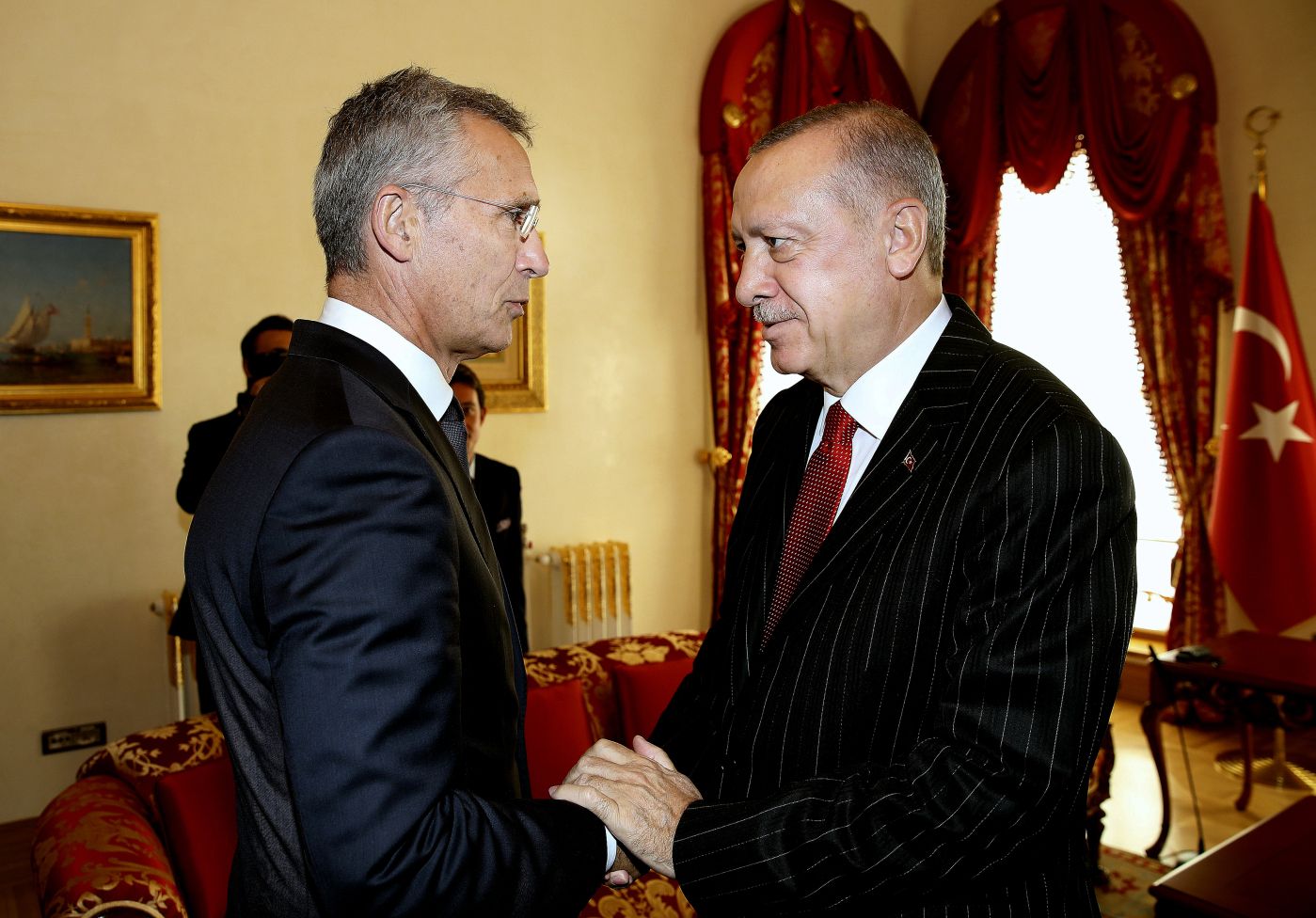 NATO Secretary General Jens Stoltenberg, left, with Turkey's President Recep Tayyip Erdogan before a meeting, in Istanbul, Friday, Oct. 11, 2019. NATO's secretary-general says Friday he acknowledges Turkey's legitimate security concerns but has urged Ankara to exercise restraint in its incursion into northeast Syria.(Presidential Press Service via AP, Pool)