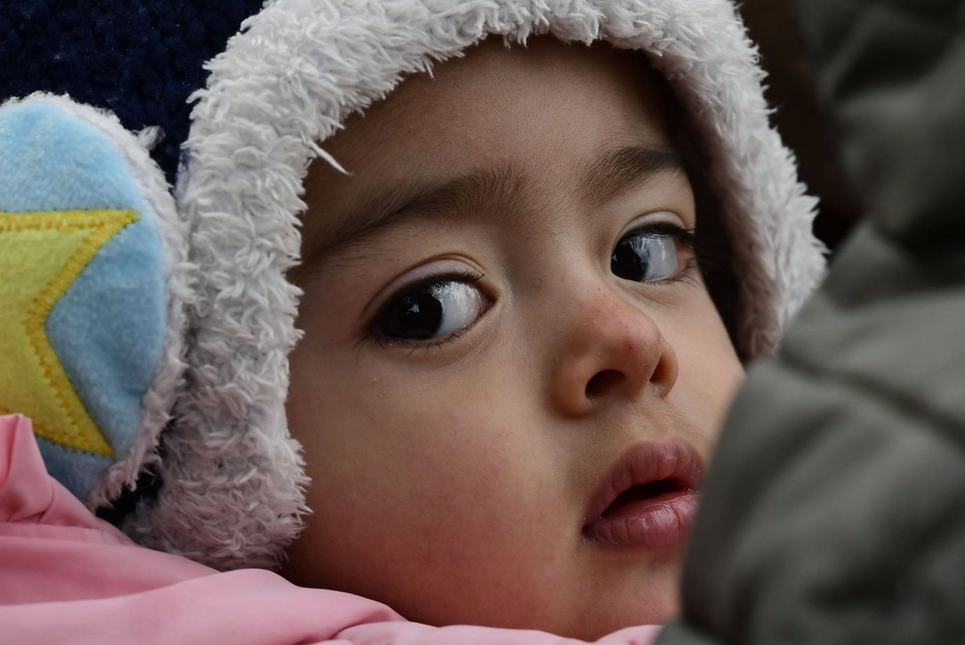 A migrant girl from Afghanistan arrives at the village of Skala Sikaminias, on the Greek island of Lesbos, after crossing the Aegean sea from Turkey, on Friday, Feb. 28, 2020. NATO envoys held emergency talks at the request of Turkey, a NATO member, and scores of migrants began converging on Turkey’s border with Greece seeking entry into Europe after Turkey said it was “no longer able to hold refugees.” (AP Photo/Michael Varaklas)