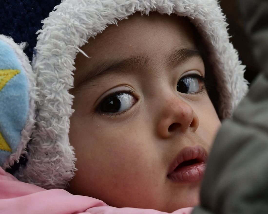 A migrant girl from Afghanistan arrives at the village of Skala Sikaminias, on the Greek island of Lesbos, after crossing the Aegean sea from Turkey, on Friday, Feb. 28, 2020. NATO envoys held emergency talks at the request of Turkey, a NATO member, and scores of migrants began converging on Turkey’s border with Greece seeking entry into Europe after Turkey said it was “no longer able to hold refugees.” (AP Photo/Michael Varaklas)