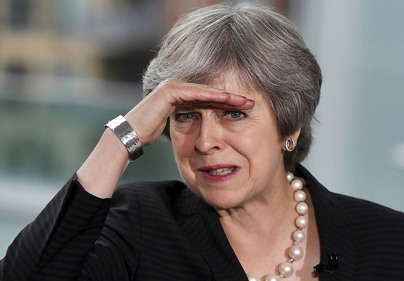 Britain's Prime Minister Theresa May gestures as she delivers a keynote speech on Brexit at Waterfront Hall in Belfast, Northern Ireland, on July 20, 2018. 
 With a trip to Northern Ireland this week, May began a tour of Britain to convince voters to back her blueprint for close economic ties with the bloc after Brexit next March. / AFP PHOTO / POOL / Charles McQuillan