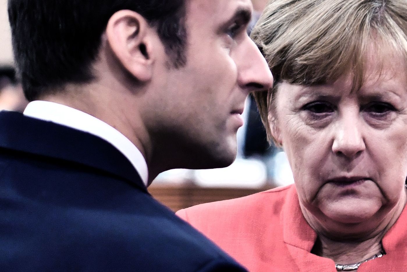 (FILES) In this file photo taken on July 07, 2017 (L-R) French President Emmanuel Macron, German Chancellor Angela Merkel and US President Donald Trump confer at the start of the first working session of the G20 meeting in Hamburg, northern Germany. 
 US President Donald Trump on March 27, 2018 spoke with European leaders about working together to counter China's alleged unfair trade practices, the White House said. The move comes as Washington and the European Union are at loggerheads over Trump's decision earlier this month to slap steep tariffs on steel and aluminum imports.Trump and German Chancellor Angela Merkel "discussed joining forces to counter China's unfair economic practices and illegal acquisition of intellectual property," the White House said in a statement. 
 / AFP PHOTO / John MACDOUGALL