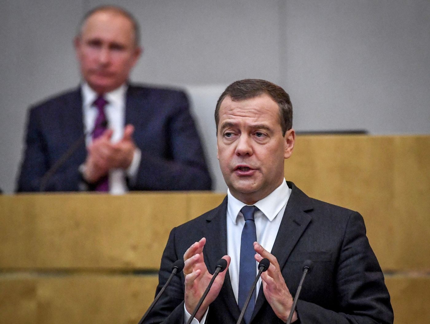 Russia's President Vladimir Putin and acting Prime Minister Dmitry Medvedev attend a session of the State Duma in Moscow on May 8, 2018. 
 The Russian parliament on May 8, 2018 voted to back a new mandate for prime minister Dmitry Medvedev, a longtime ally of President Vladimir Putin who also served a Kremlin term from 2008 to 2012. / AFP PHOTO / Yuri KADOBNOV