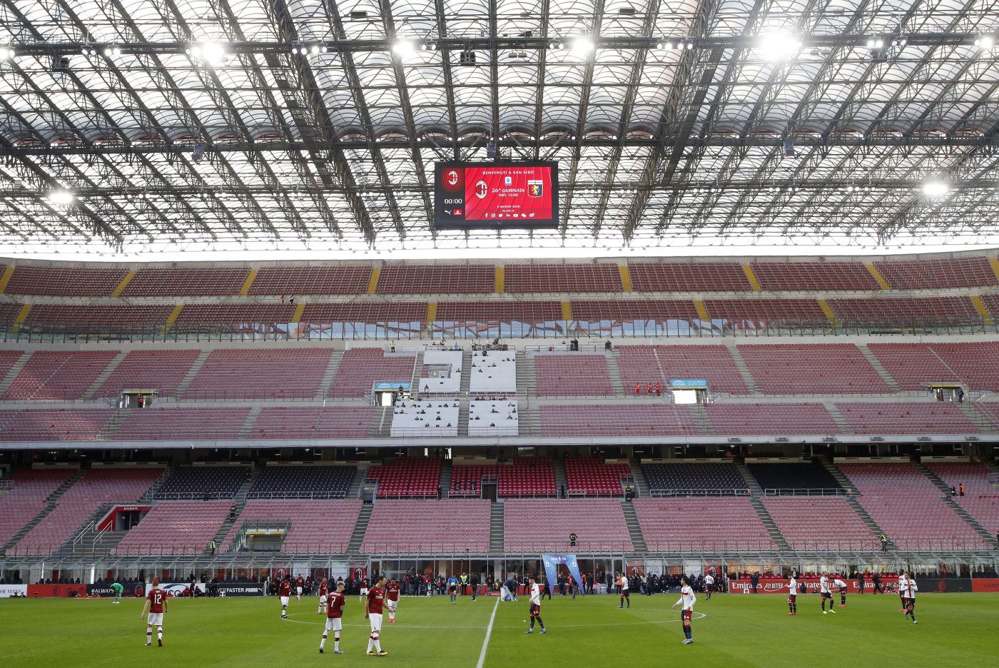 A view of the empty stadium during the Serie A soccer match between AC Milan and Genoa at the San Siro stadium, in Milan, Italy, Sunday, March 8, 2020. Serie A played on Sunday despite calls from Italyís sports minister and playersí association president to suspend the games in Italyís top soccer division. (AP Photo/Antonio Calanni)