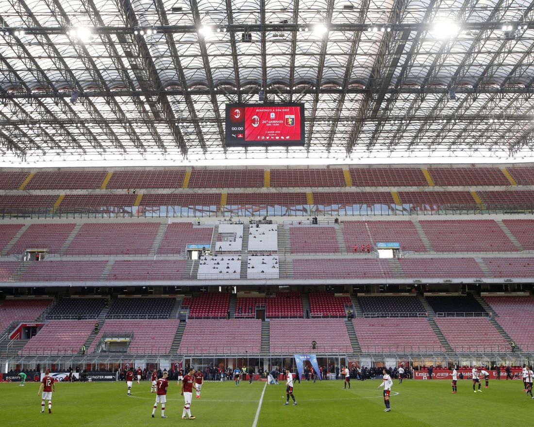 A view of the empty stadium during the Serie A soccer match between AC Milan and Genoa at the San Siro stadium, in Milan, Italy, Sunday, March 8, 2020. Serie A played on Sunday despite calls from Italyís sports minister and playersí association president to suspend the games in Italyís top soccer division. (AP Photo/Antonio Calanni)