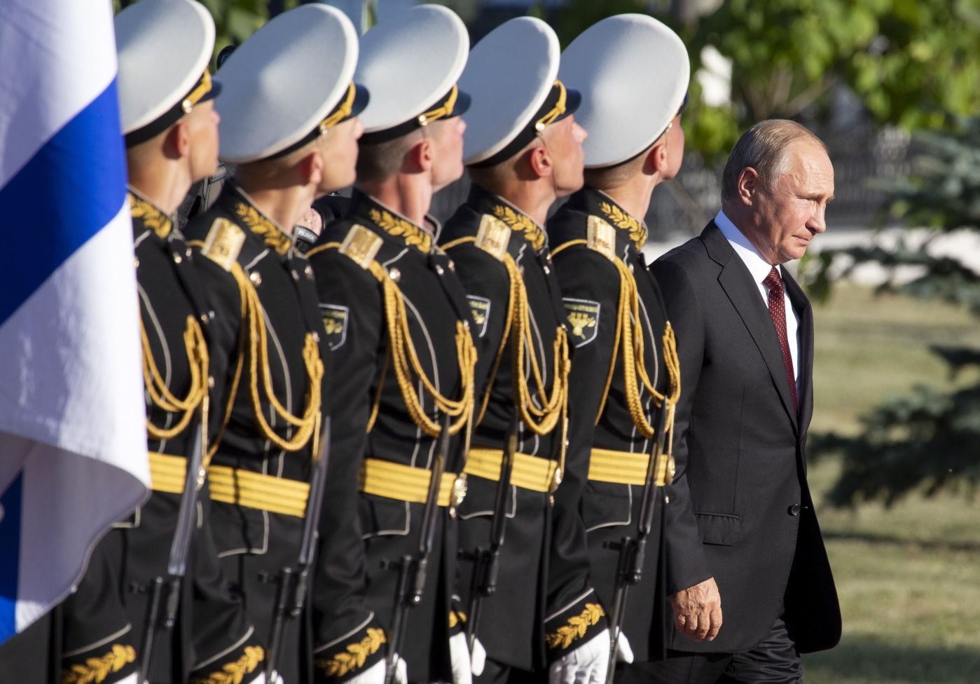 FILE - In this file photo taken on Thursday, Aug. 23, 2018, Russian President Vladimir Putin, right, arrives to attend a laying ceremony in Kursk, 426 kilometers (266 miles) south of Moscow, Russia. Putin may look like a winner after an abrupt U.S. decision to pull out of Syria, but the Russian leader faces massive challenges in Syria and elsewhere, and he hasn't moved an inch closer to the lifting of Western sanctions that have emaciated the national economy. (AP Photo/Alexander Zemlianichenko, Pool, File)