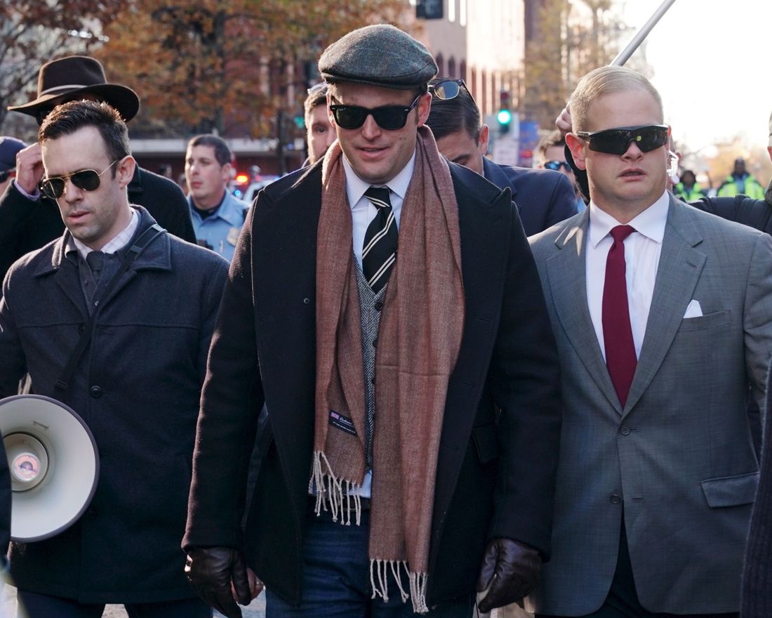 (FILES) In this file photo taken on December 3, 2017, White nationalist Richard Spencer (C) marches on a street near the White House with supporters during an anti-immigration protest in Washington, DC. - An organizer of a notorious white nationalist rally held in Charlottesville, Virginia, nearly two years ago said it would not have taken place had Donald Trump not become president, in May 2019. "There is no question that Charlottesville wouldn't have occurred without Trump," Richard Spencer, a leader of the so-called "alt-right," said in an interview with The Atlantic magazine. (Photo by MANDEL NGAN / AFP)