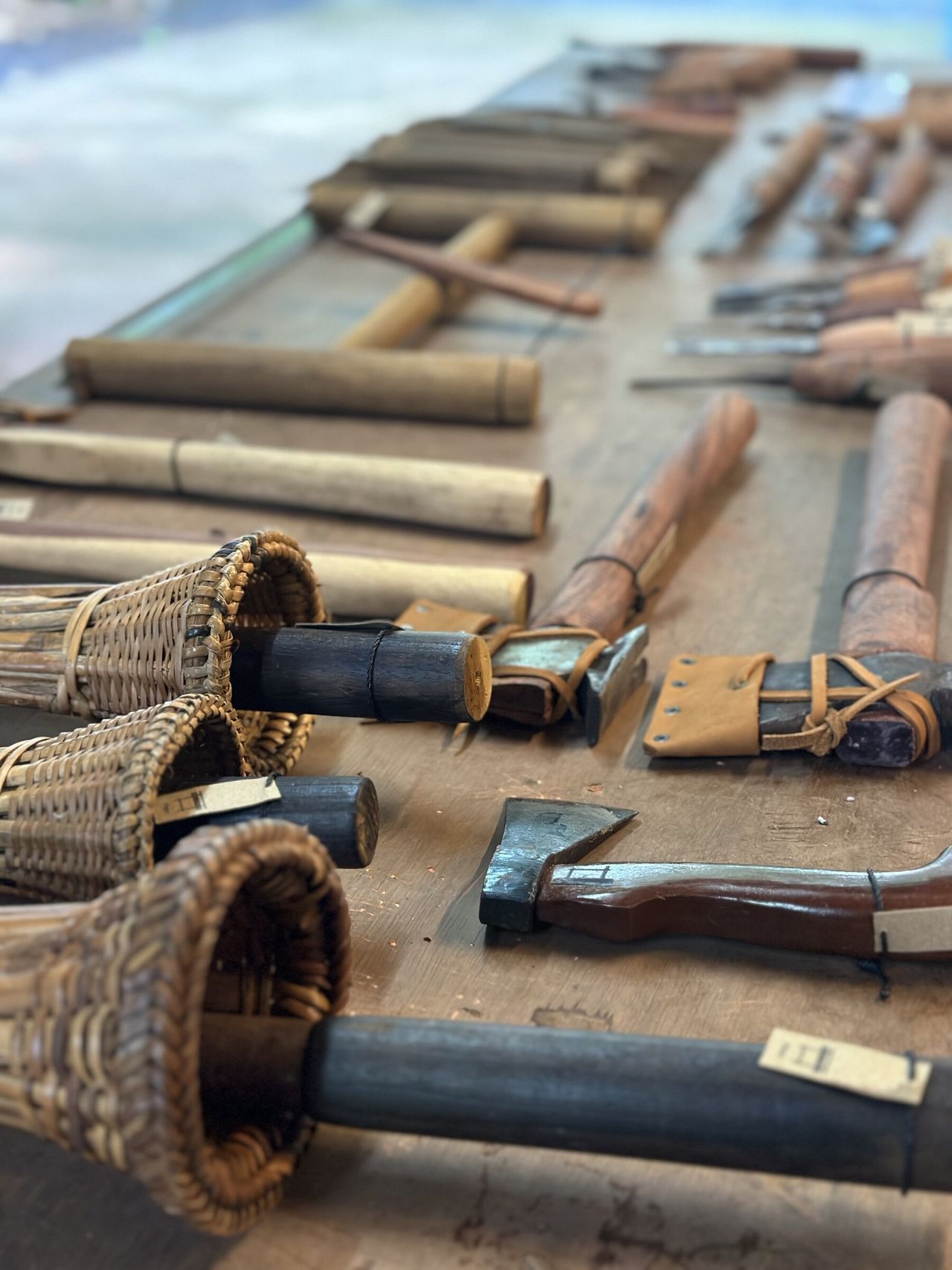 Wooden-handled woodworking tools displayed on a table