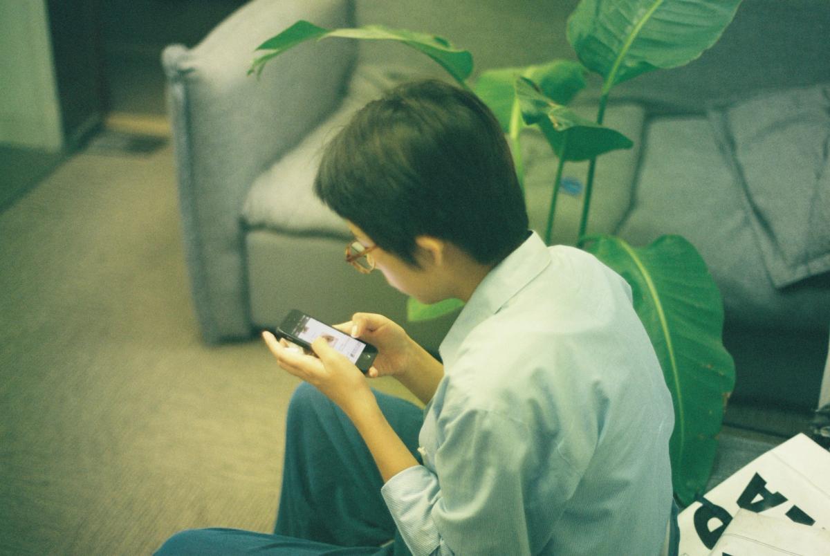 Boy Using Mobile - RAG Use Cases