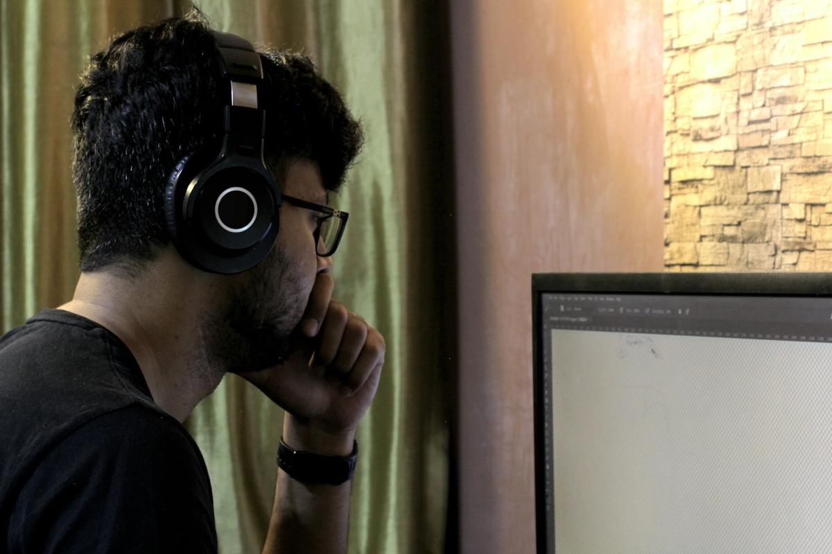 person on laptop - Monitoring ML Models in Production