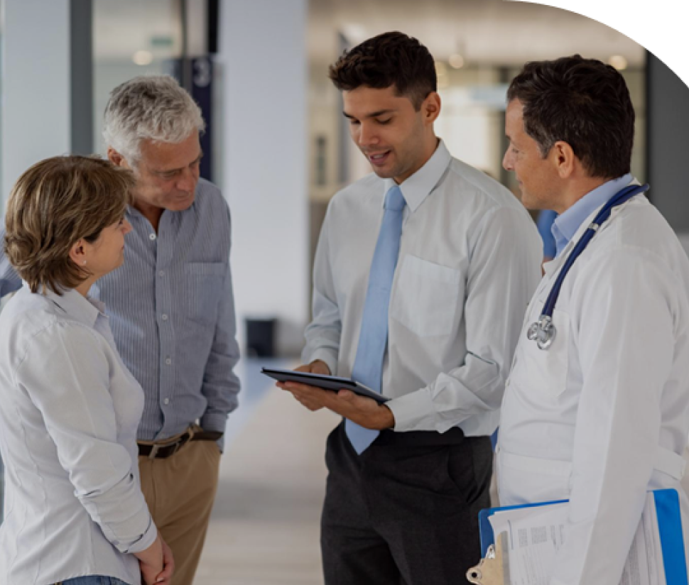 Clinicians and patients talking in a practice corridor