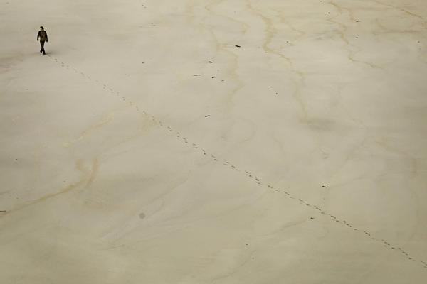 man walking in desert