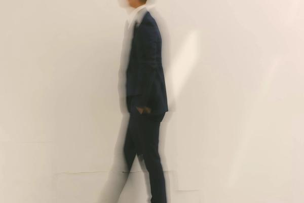 man walking in suite