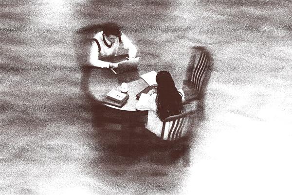 Two people sitting at table 