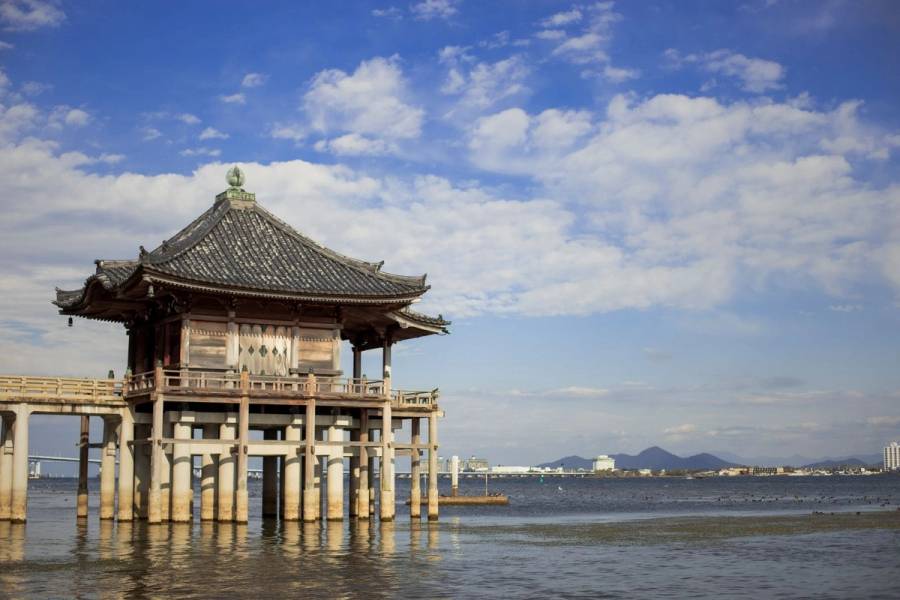 Shiga Ukimidou Temple in the foreground with Biwa Lake and Otsu City in the background. This temple is located in Shiga Prefecture, Japan.