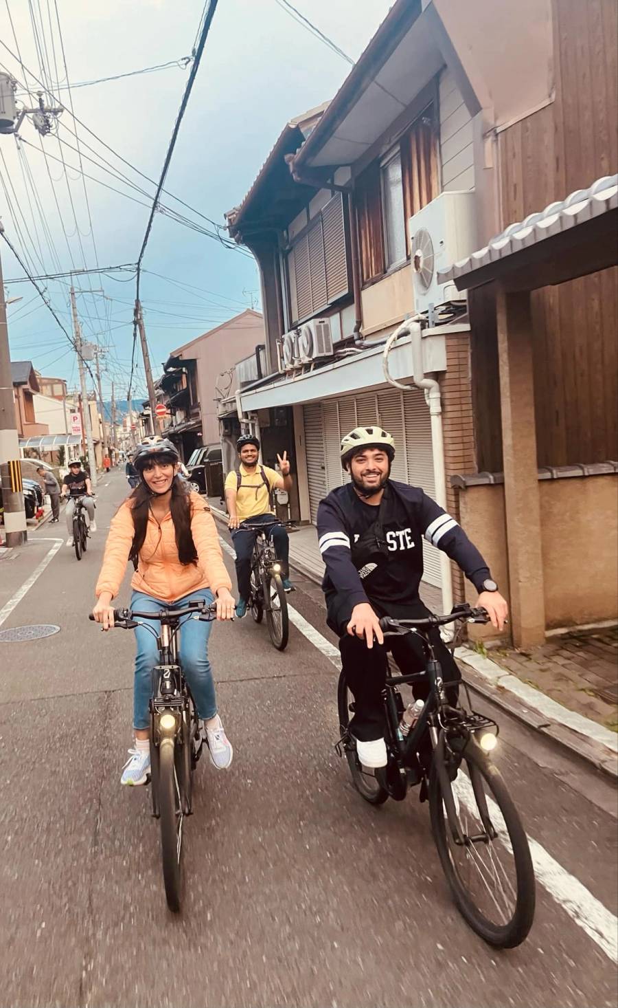 A Noru Kyoto Bike Tour group cruising down Kyoto's suburban backstreets. 