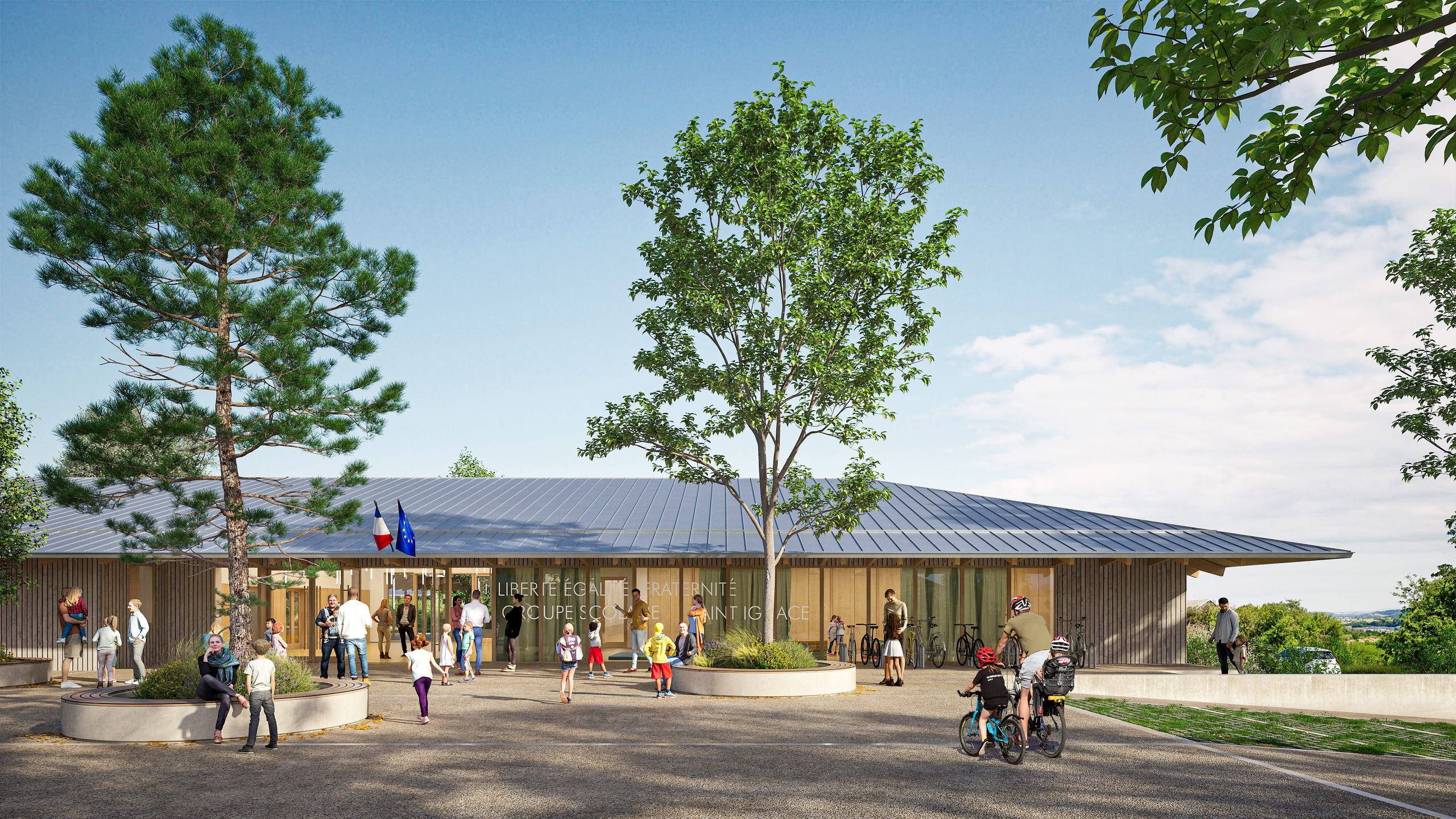 Entrée du groupe scolaire Saint-Ignace à Vienne, sous une toiture en zinc à large débord, avec façade vitrée, bardage bois et parvis arboré.