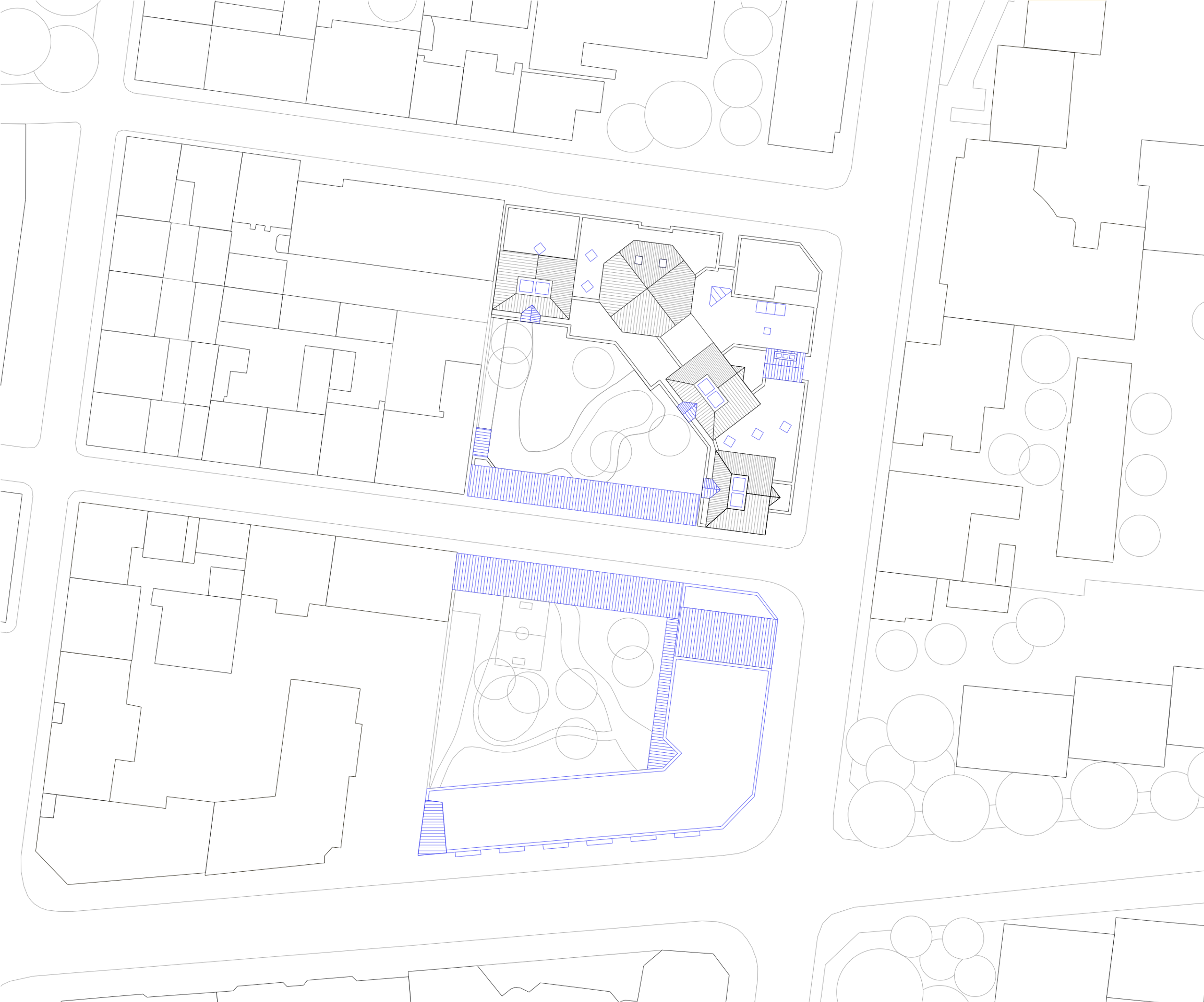 Plan masse du groupe scolaire Pompidou Mourguet à Lyon, montrant l’école élémentaire en équerre, les cours paysagées intérieures et l’insertion dans l’îlot urbain.